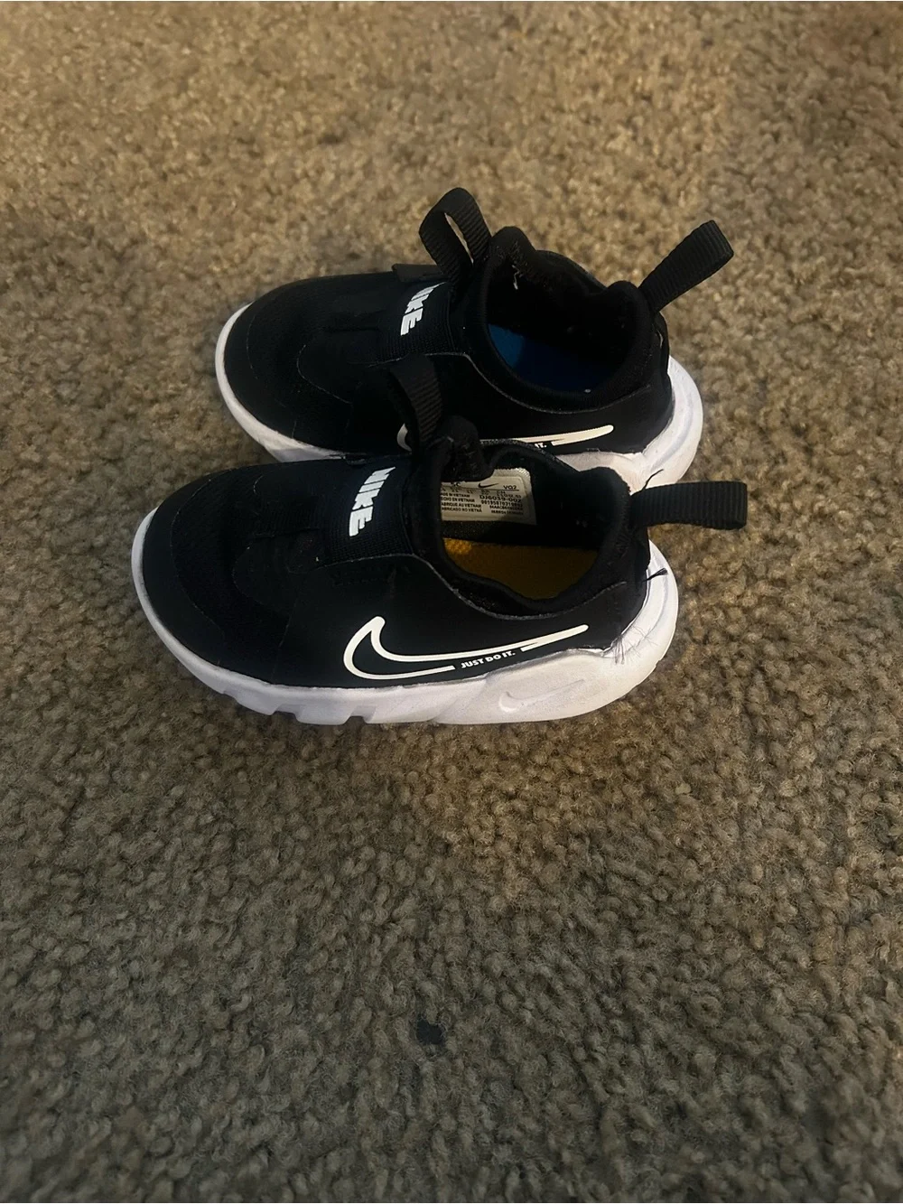 Nike Black and White Kids Slip-On Athletic Sneakers